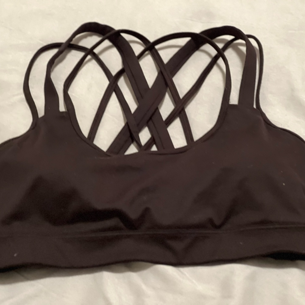 Black Victoria’s Secret sports bra.